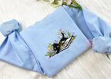 embroidered book, cat, and flower sweartshirt
