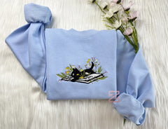 Cute Cat Lying On Book With Flower Embroidered Book Sweatshirt